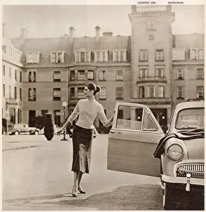 Golf Prints: The Gleneagles Hotel - A glamorous model in trendy knitwear at the front of the hotel getting into her car