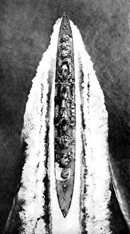 Prints of Aerial photograph showing the Royal Navy cruiser HMS Argonaut steaming at high speed during the Second World War, 1945. HMS Argonaut was a Dido class cruiser of 5450 tons, mounting ten 5.25-inch guns October Prints: HMS Argonaut steaming at high speed; Second World War, 194