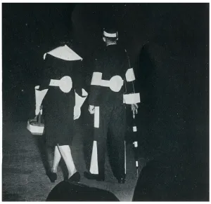 White Prints: Man and woman in reflective clothing, September 1939