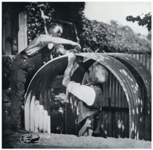 Building Prints: Two men building an Anderson shelter, September 1939