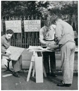 Precautions Prints: Men painting warning signs for unexploded bombs, Sept 1939