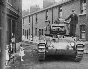 Houses Prints: A military tank parked in a residential street