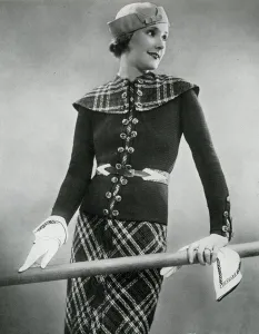 Belt Prints: Model wearing tartan skirt and jacket
