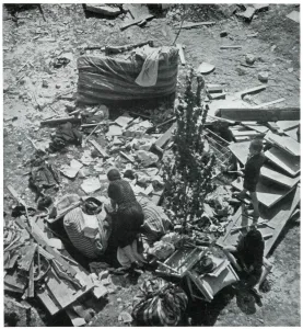 Bomb Prints: Mother searching for her belongings in debris 1939
