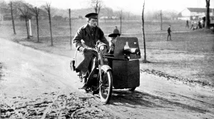 Cycle Prints: A motor-cycle with a side-car machine gun
