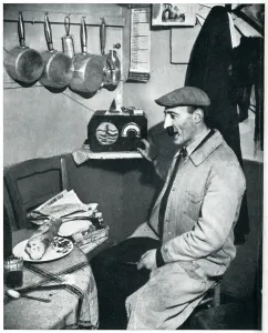 News Prints: Outbreak of WWII Parisian greengrocer listens to the news