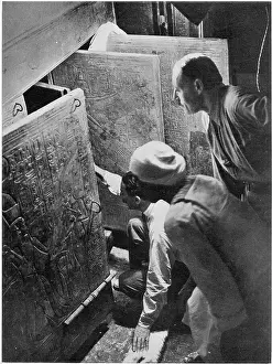 Opens Prints: Photograph of the moment Howard Carter (kneeling) and Arthur Callender (standing)