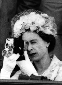 Cameras Prints: Queen Elizabeth II using a cine camera