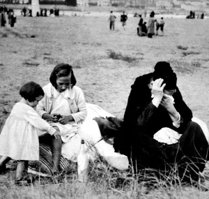 Forces Prints: Refugees from Irun sitting on the beach at Hendaye; Spanish