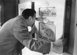 Maugham Prints: Robin Maugham looking at a peep-show in Brighton