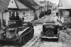 Polish Prints: Russian armoured car rattles through Polish town, 1939