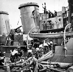 Sacks Prints: Sailors carrying potatoes onto HMS Coventry, Second World