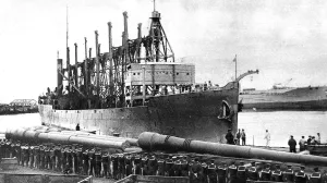 Bringing Prints: The Santa Claus ship from the United States, with big naval guns in the foreground