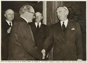 Desert Prints: Sir Anthony Eden (right) shakes hands with French Premier Guy Alcide Mollet (1905-1975