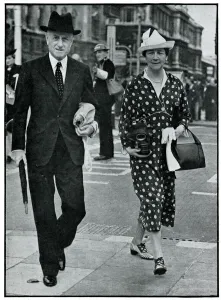 Minister Prints: Sir Hoare and his wife carrying gas masks, September 1939