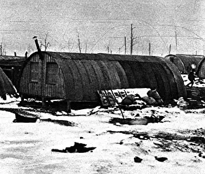 Huts Prints: Weatherproof winter field-barracks: snowy Nissen huts, 1917