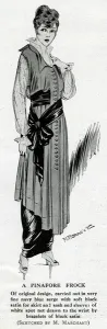 Buttons Prints: Woman in elegant pinafore frock with sash
