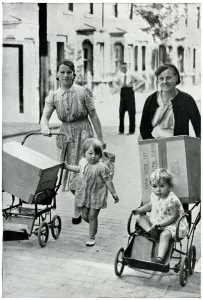 Mask Prints: Two women with infants and new baby gas masks, Sept 1939